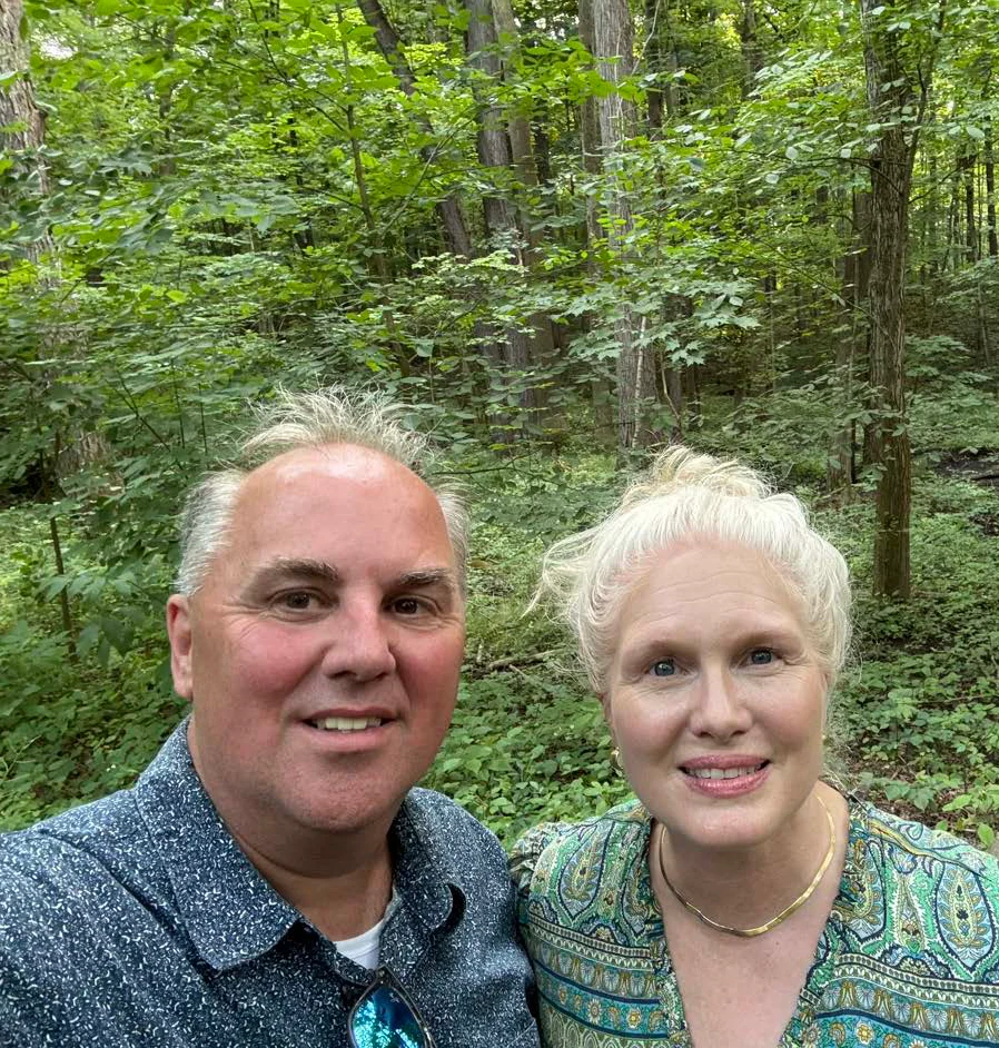 Rick and Amy McGee together in the Sacred Grove